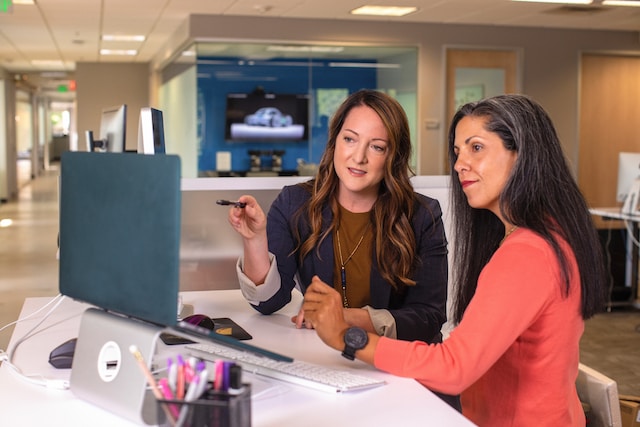 Two women having a work-related discussion.