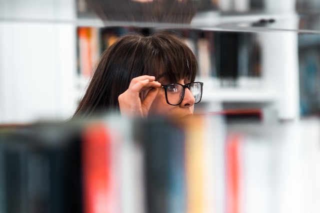 Woman adjusting her glasses