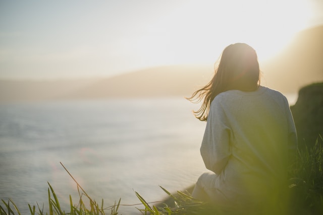 A woman staring out at the water