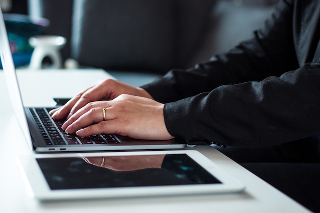 Person typing on a laptop