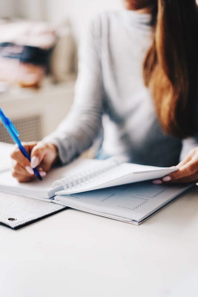 Woman writing on a journal