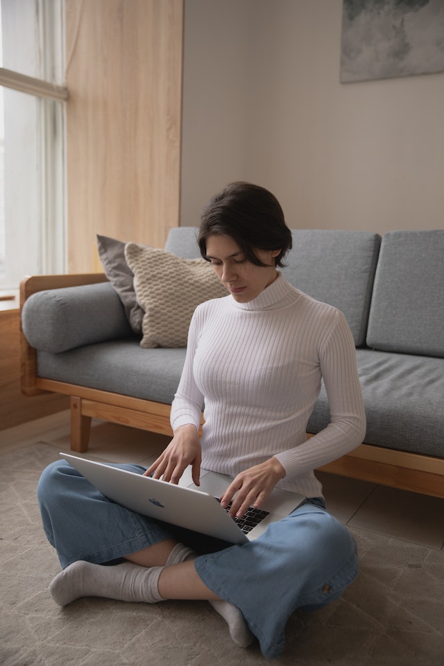 Woman working in her living room