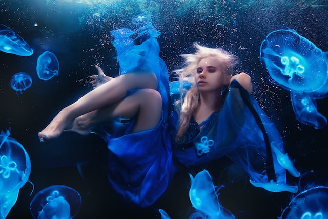 Woman in blue underwater
